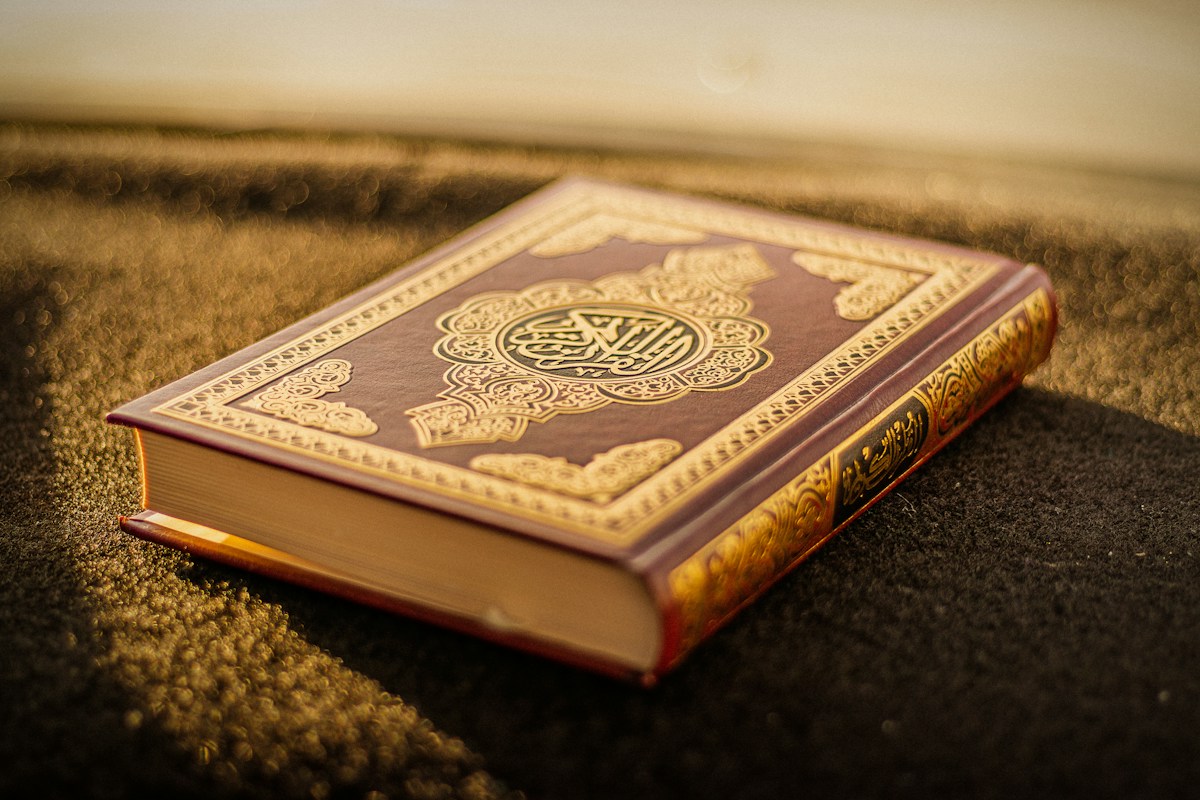 A beautifully bound Quran in warm natural light